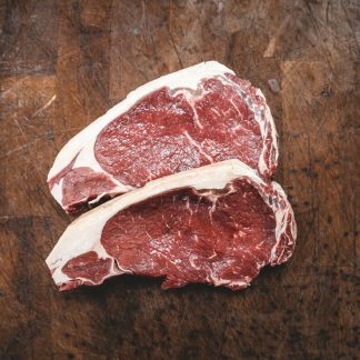 raw meat on brown wooden table